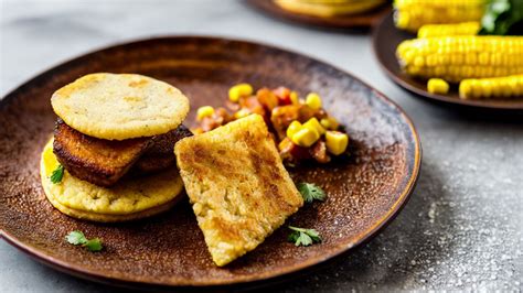  Arepas: The Crispy Perfection of Grilled Corn Cakes Meets Savory Delight!